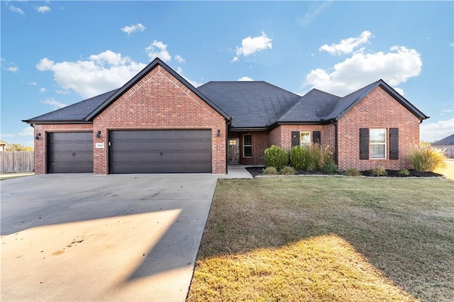 view of front facade with a garage and a front yard