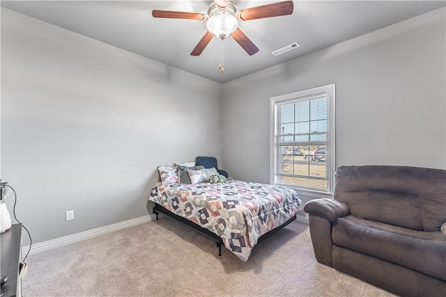 bedroom featuring ceiling fan and light colored carpet