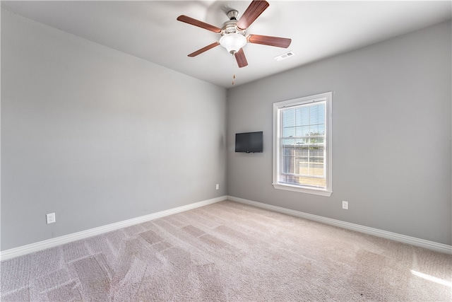 carpeted empty room with ceiling fan