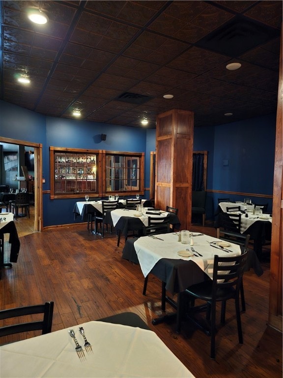 dining area with dark hardwood / wood-style floors