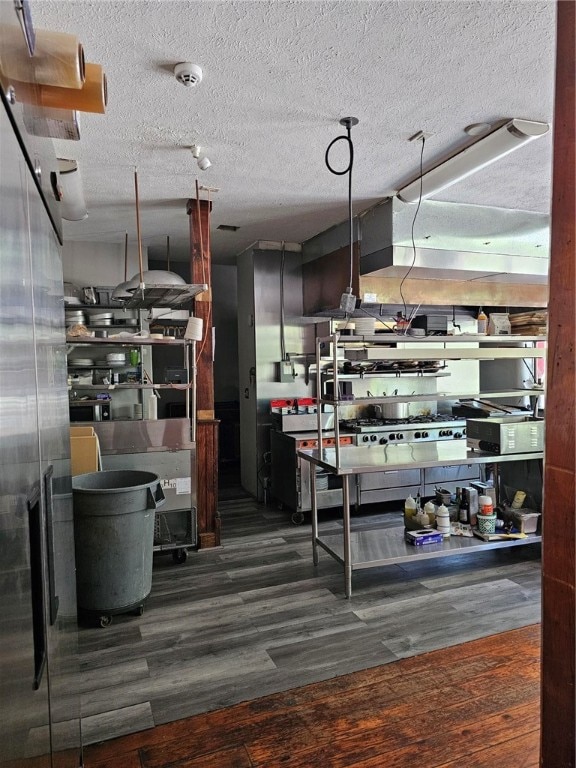 kitchen featuring dark hardwood / wood-style floors and a textured ceiling