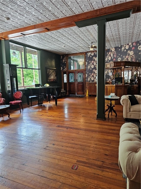 living room with hardwood / wood-style flooring and beamed ceiling