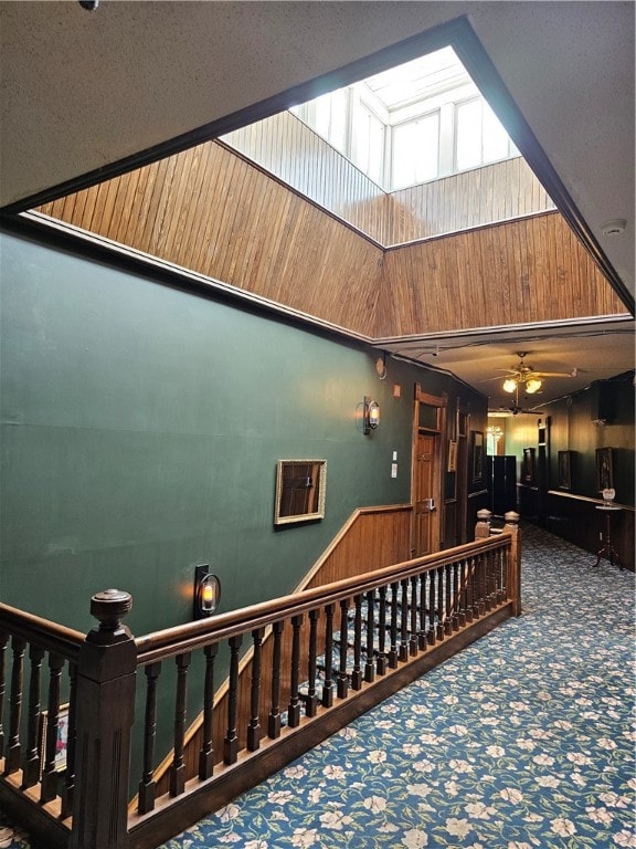 stairs with a skylight