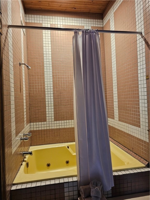 bathroom with shower / bathtub combination with curtain