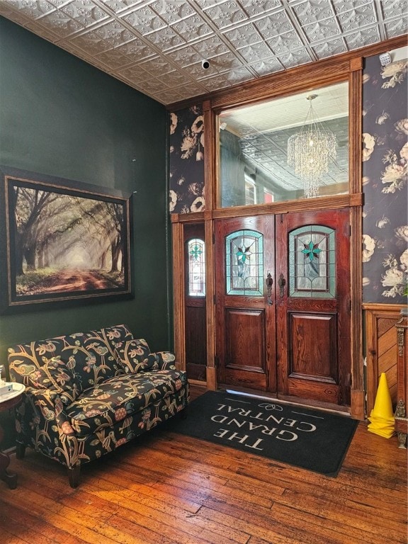 foyer featuring a chandelier and wood-type flooring