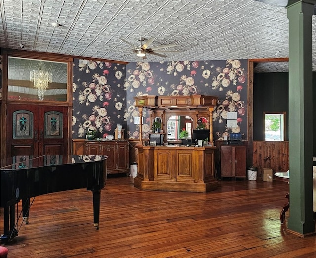 miscellaneous room with ornamental molding, dark hardwood / wood-style floors, and ceiling fan