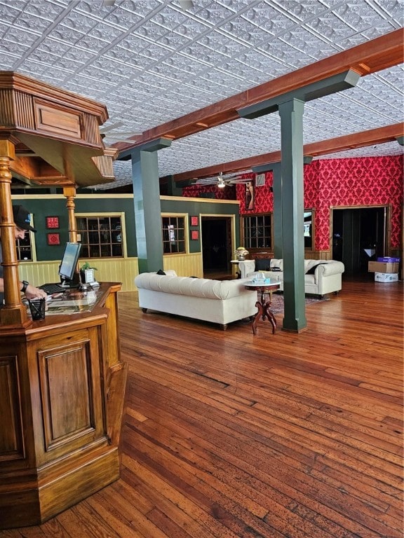 living room featuring ceiling fan, lofted ceiling with beams, and dark hardwood / wood-style flooring