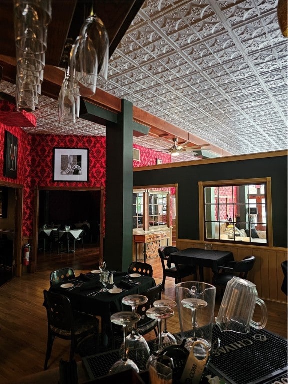 dining space with lofted ceiling, hardwood / wood-style flooring, and ceiling fan