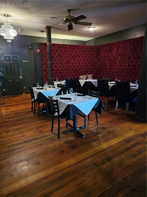 dining room featuring ceiling fan and dark hardwood / wood-style floors