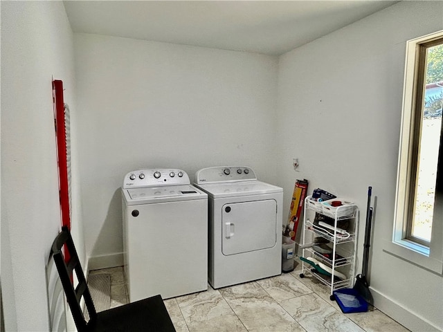 clothes washing area featuring washing machine and clothes dryer