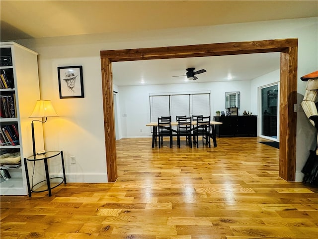 dining room featuring light hardwood / wood-style floors and ceiling fan