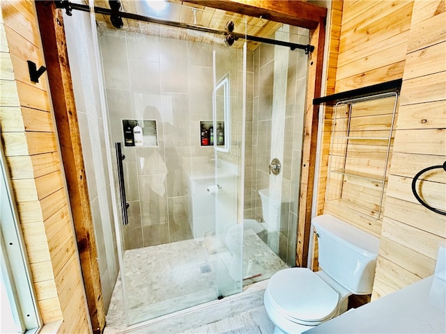 bathroom featuring toilet, an enclosed shower, and wood walls