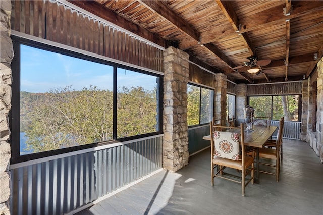 unfurnished sunroom featuring plenty of natural light and ceiling fan