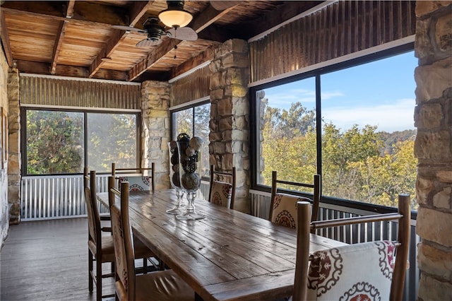 sunroom featuring ceiling fan and wooden ceiling