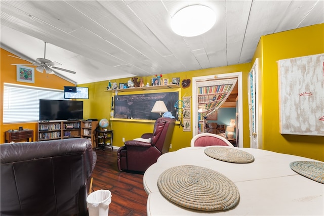 dining space featuring vaulted ceiling, ceiling fan, and dark hardwood / wood-style flooring