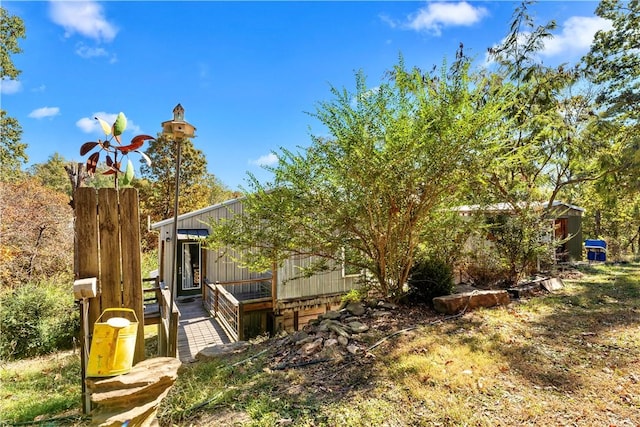 view of yard featuring a wooden deck