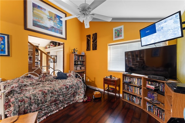 bedroom with ceiling fan, hardwood / wood-style flooring, and lofted ceiling