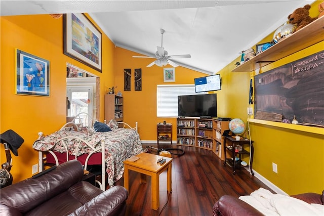 living area featuring wood finished floors, vaulted ceiling, baseboards, and ceiling fan