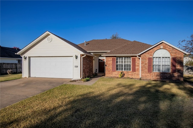 ranch-style home featuring a front yard and a garage