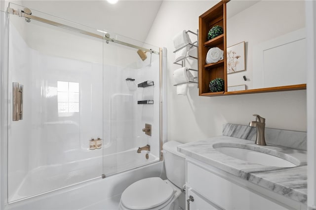 full bathroom with enclosed tub / shower combo, vanity, and toilet