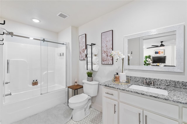 full bathroom with tile patterned floors, toilet, shower / bath combination with glass door, vanity, and ceiling fan