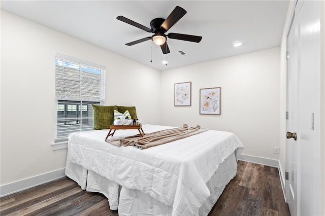 bedroom with dark wood-type flooring and ceiling fan