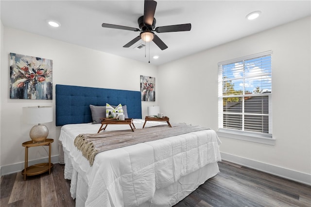 bedroom featuring dark hardwood / wood-style flooring and ceiling fan