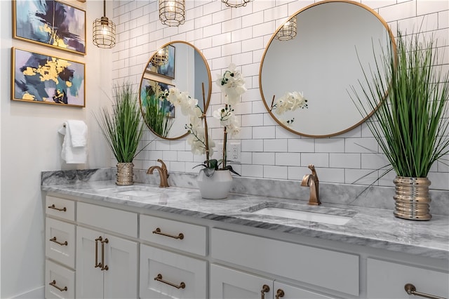 bathroom featuring vanity and backsplash