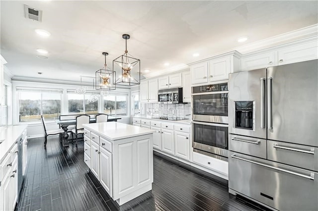 kitchen featuring white cabinetry, a healthy amount of sunlight, and appliances with stainless steel finishes