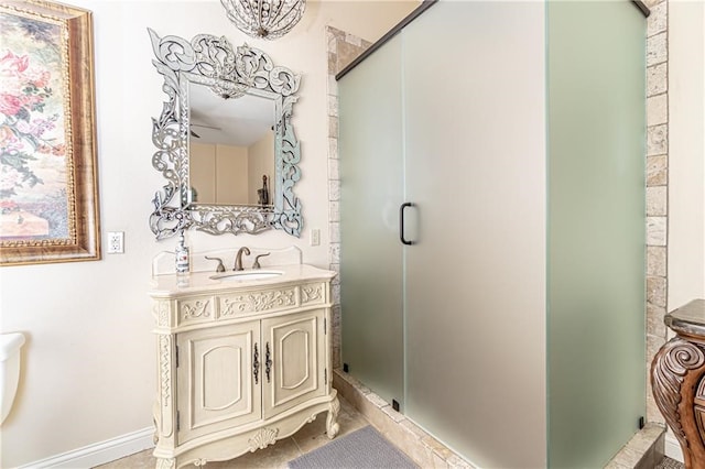 bathroom with vanity and a shower with door