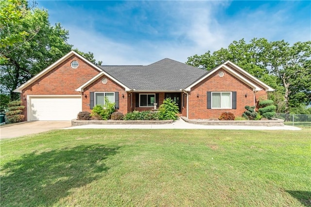 single story home featuring a front lawn and a garage