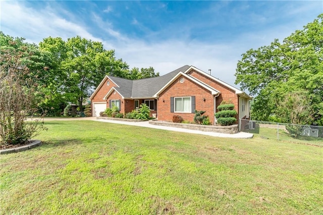 ranch-style home with a front lawn and a garage