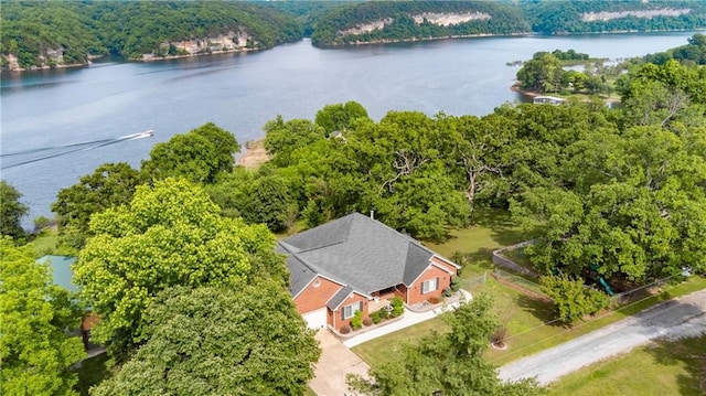 birds eye view of property with a water view