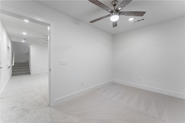 unfurnished room with light carpet and ceiling fan