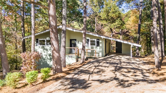 view of front of property featuring a carport