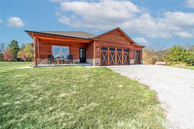 114 Ledgewood, Berryville, AR 72616 - view of front of property featuring gravel driveway, an attached garage, stone siding, roof with shingles, and a front yard