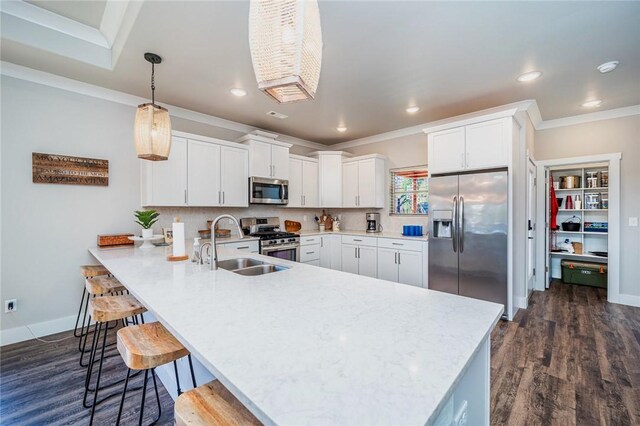 114 Ledgewood, Berryville, AR 72616 - kitchen featuring stainless steel appliances, light countertops, a sink, crown molding, and a peninsula