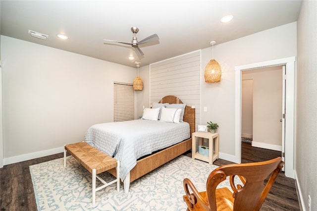 bedroom featuring hardwood / wood-style flooring and ceiling fan