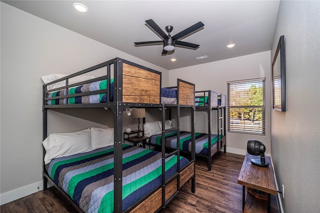 bedroom with ceiling fan and dark hardwood / wood-style flooring