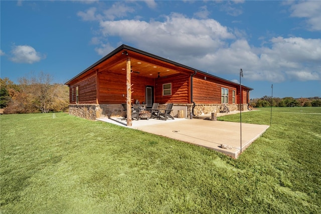 exterior space featuring a patio area and a lawn