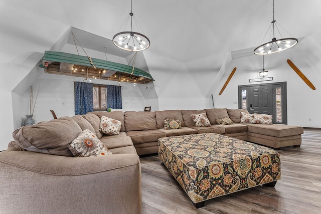 living room featuring hardwood / wood-style flooring and a chandelier