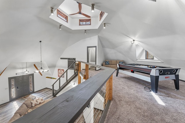 playroom featuring lofted ceiling, carpet flooring, and ceiling fan