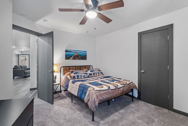 carpeted bedroom with ceiling fan