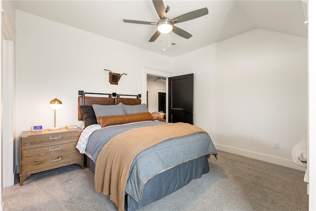 bedroom featuring carpet flooring, vaulted ceiling, and ceiling fan