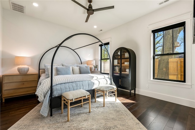 bedroom with ceiling fan and dark hardwood / wood-style floors