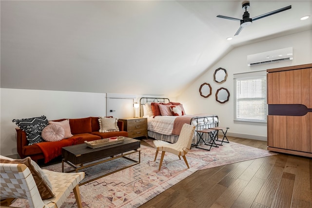 bedroom with ceiling fan, an AC wall unit, vaulted ceiling, and light wood-type flooring