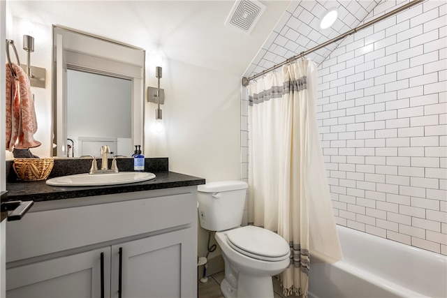 full bathroom featuring vanity, toilet, and shower / bath combo with shower curtain