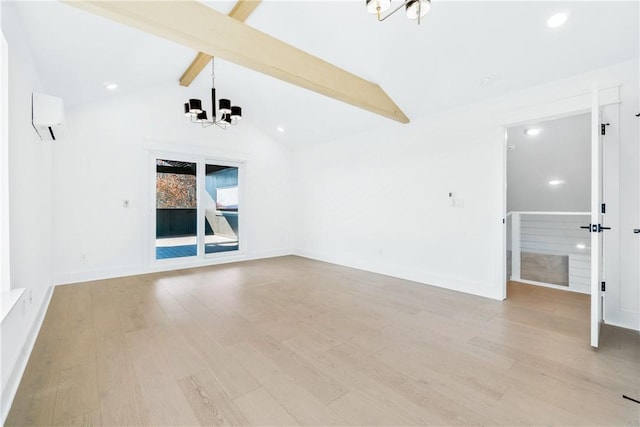 empty room with an AC wall unit, an inviting chandelier, lofted ceiling with beams, and light hardwood / wood-style flooring