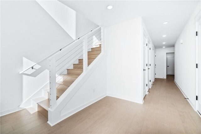 stairs with wood-type flooring