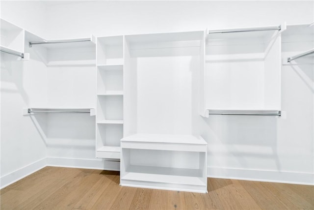 walk in closet featuring light hardwood / wood-style flooring